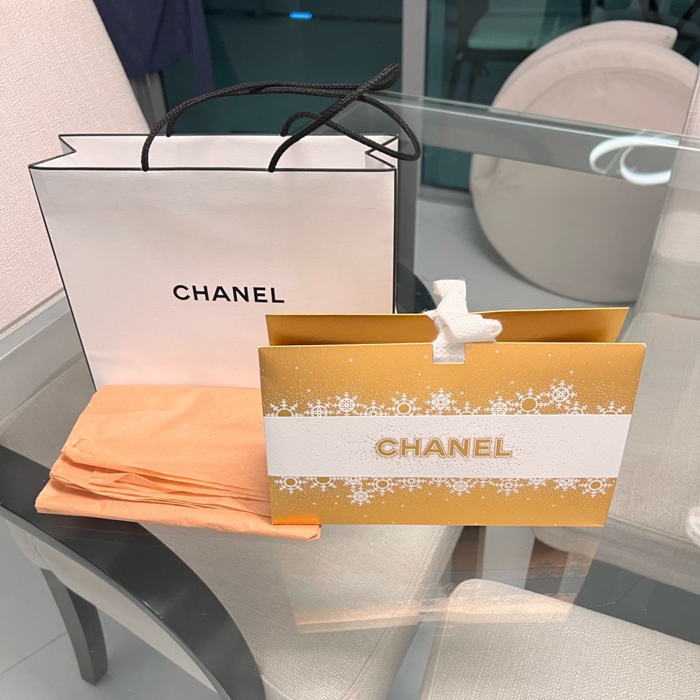 Chanel set of boxes/shopping bags
